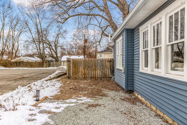 view of yard layered in snow