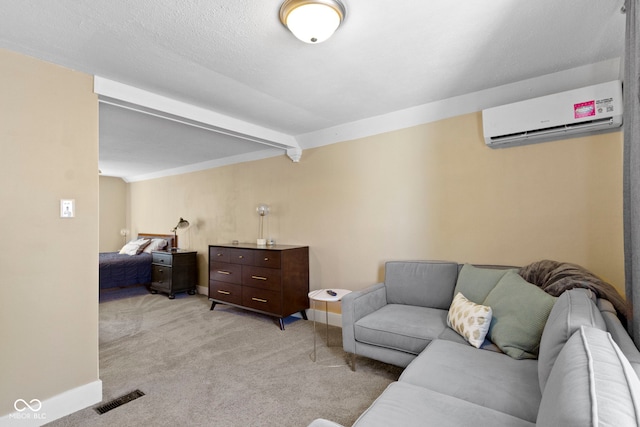 carpeted living room featuring a wall mounted air conditioner and beam ceiling