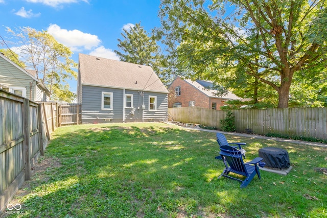 rear view of house with a yard