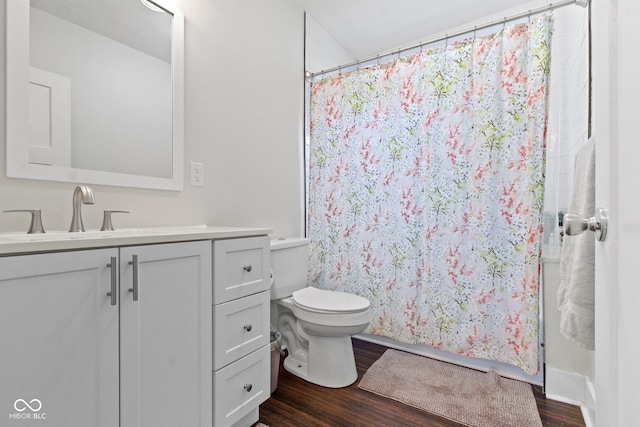 bathroom featuring hardwood / wood-style floors, toilet, and vanity