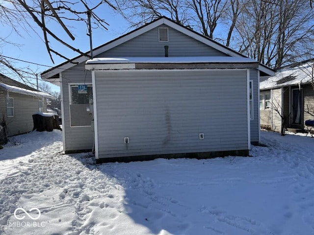 view of snow covered garage