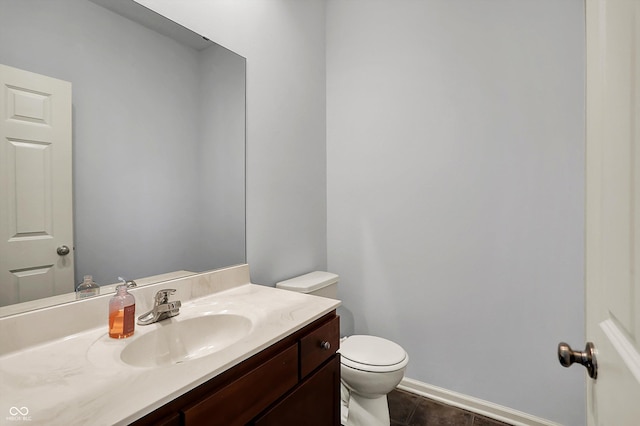 386 White Oak Ln, Greenwood, IN 46142 - bathroom featuring toilet, baseboards, vanity, and tile patterned flooring