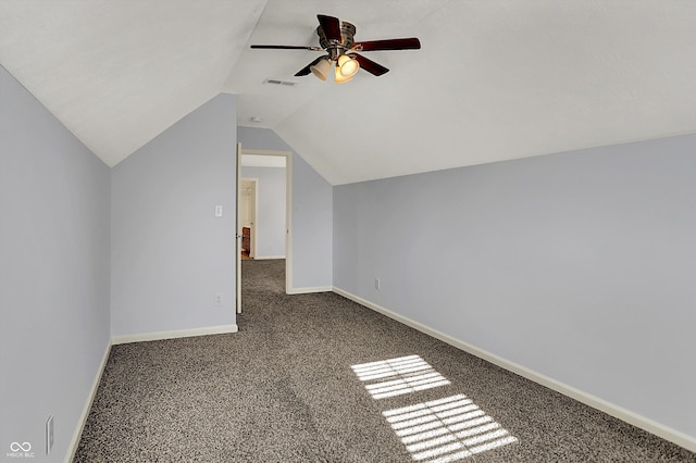386 White Oak Ln, Greenwood, IN 46142 - additional living space featuring carpet flooring, a ceiling fan, visible vents, baseboards, and vaulted ceiling