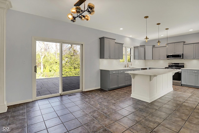 386 White Oak Ln, Greenwood, IN 46142 - kitchen featuring baseboards, light countertops, stainless steel appliances, and gray cabinetry