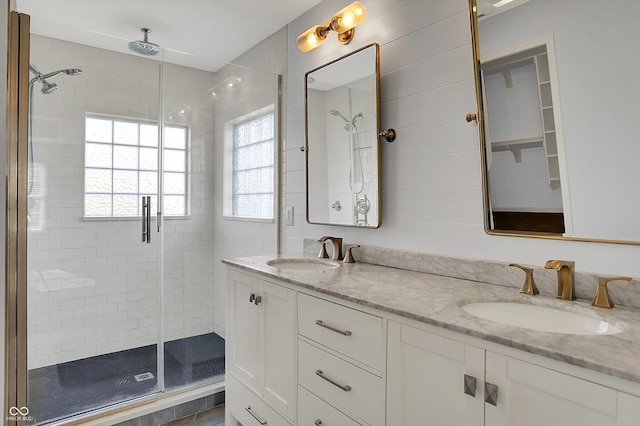 386 White Oak Ln, Greenwood, IN 46142 - bathroom with a stall shower, double vanity, and a sink