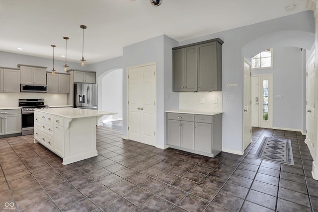 386 White Oak Ln, Greenwood, IN 46142 - kitchen with arched walkways, appliances with stainless steel finishes, and gray cabinets