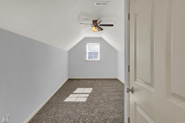 386 White Oak Ln, Greenwood, IN 46142 - additional living space with carpet, baseboards, ceiling fan, visible vents, and vaulted ceiling