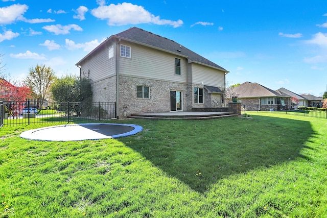 386 White Oak Ln, Greenwood, IN 46142 - rear view of property with a fenced backyard, a patio area, brick siding, and a lawn
