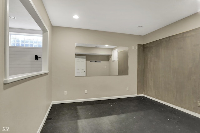 386 White Oak Ln, Greenwood, IN 46142 - unfurnished room with concrete floors, baseboards, and recessed lighting