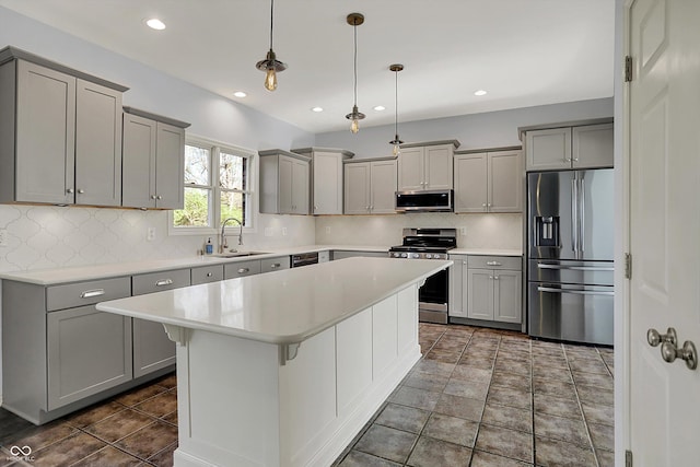 386 White Oak Ln, Greenwood, IN 46142 - kitchen featuring gray cabinetry, appliances with stainless steel finishes, light countertops, and a sink