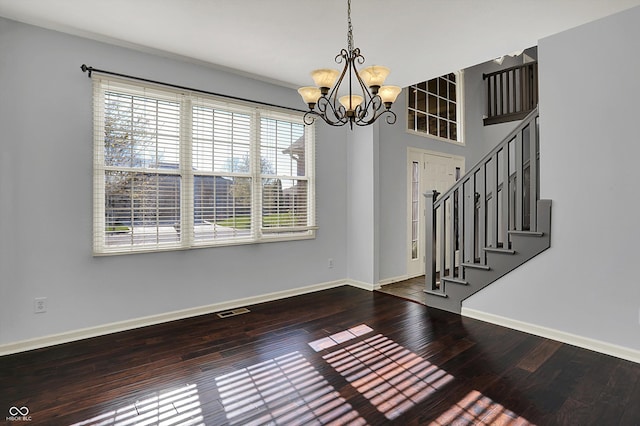 386 White Oak Ln, Greenwood, IN 46142 - interior space with wood finished floors, a chandelier, baseboards, and visible vents