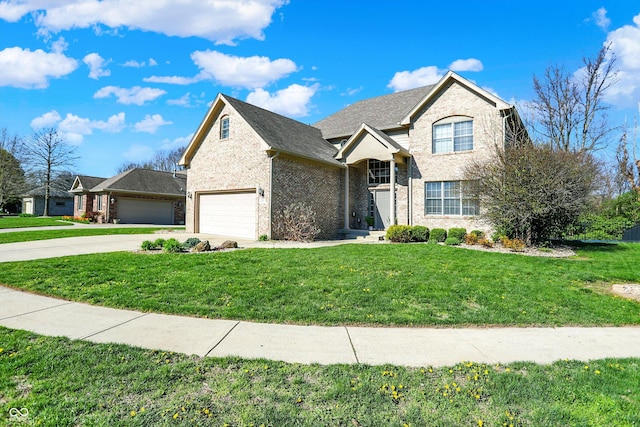 386 White Oak Ln, Greenwood, IN 46142 - traditional-style home featuring a front lawn, brick siding, and driveway