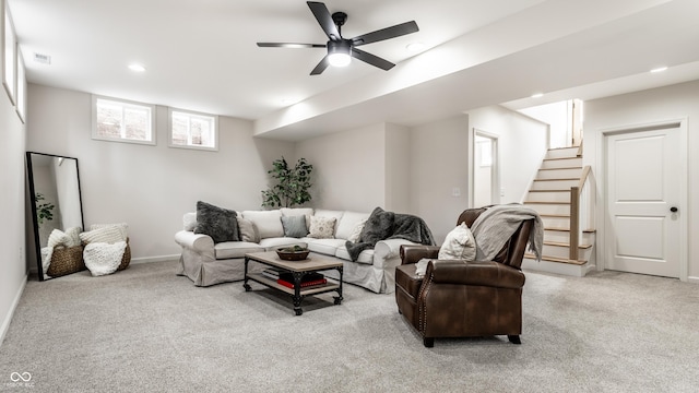 living room with ceiling fan and light carpet