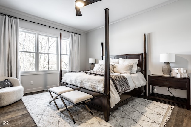 bedroom featuring light wood finished floors, ceiling fan, baseboards, and crown molding