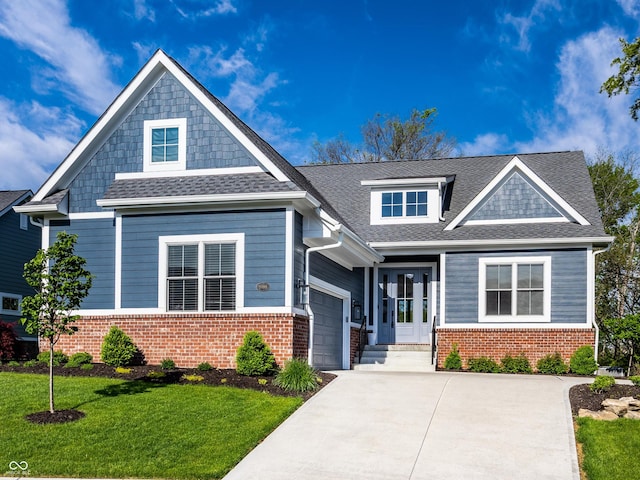 20188 Hampton Park Dr, Westfield, IN 46074 - craftsman-style house with driveway, a front yard, a garage, and brick siding