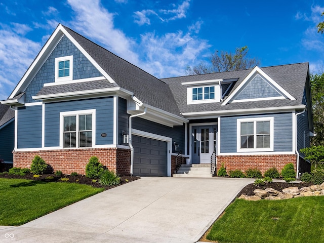 20188 Hampton Park Dr, Westfield, IN 46074 - craftsman-style house with brick siding, an attached garage, a front yard, and concrete driveway