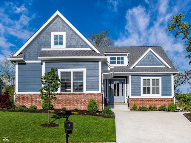 20188 Hampton Park Dr, Westfield, IN 46074 - craftsman house with brick siding, a front yard, and a shingled roof