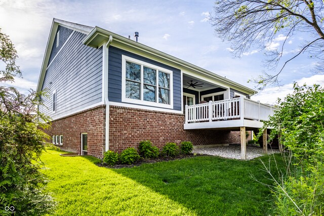 20188 Hampton Park Dr, Westfield, IN 46074 - rear view of property with brick siding, a lawn, a wooden deck, and a ceiling fan