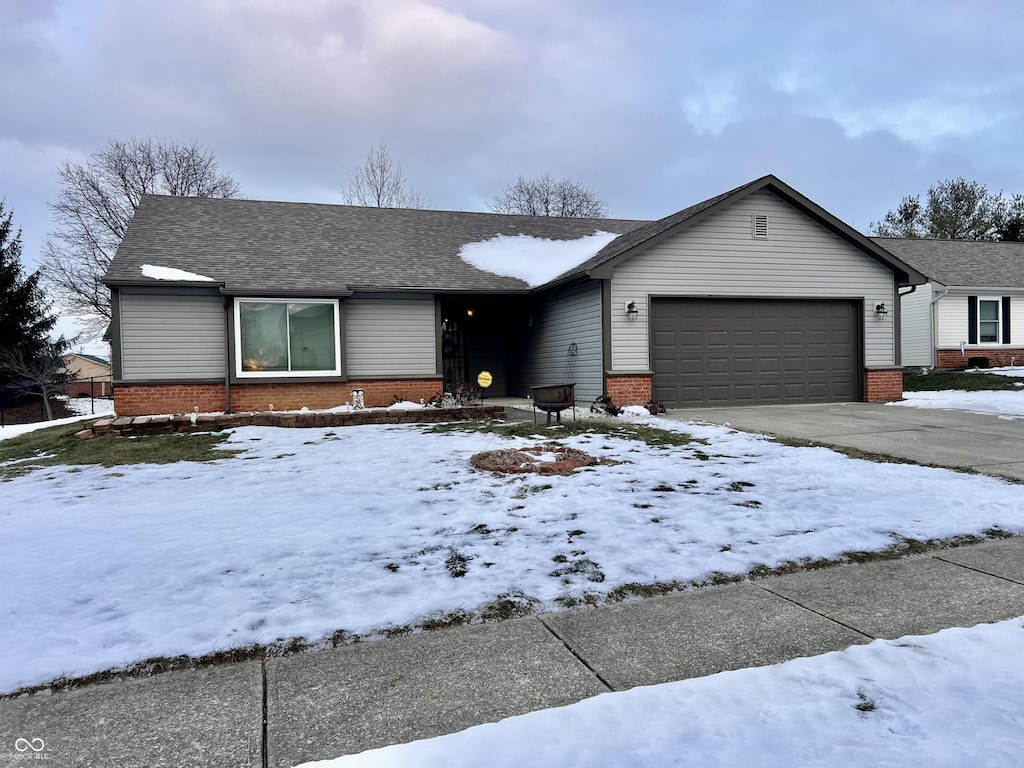 single story home with a garage