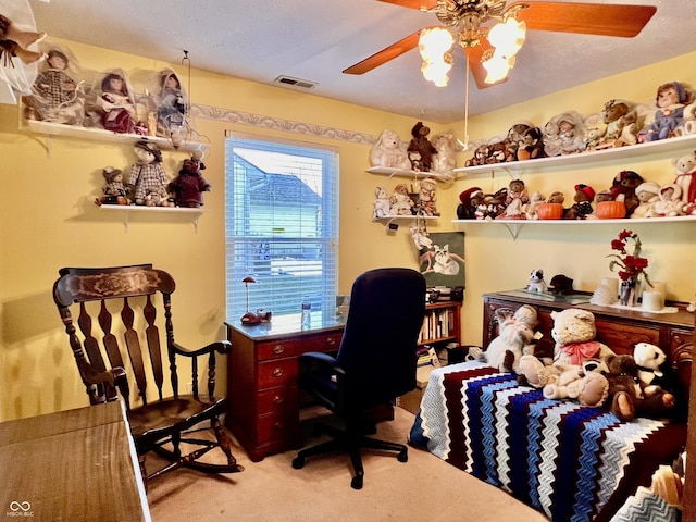 office space with light carpet and ceiling fan