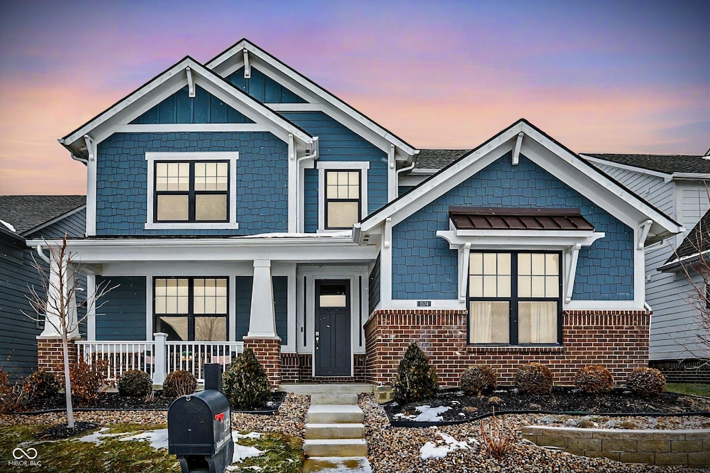 craftsman inspired home featuring a porch