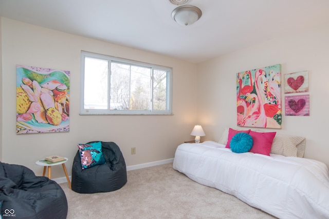 bedroom featuring light colored carpet