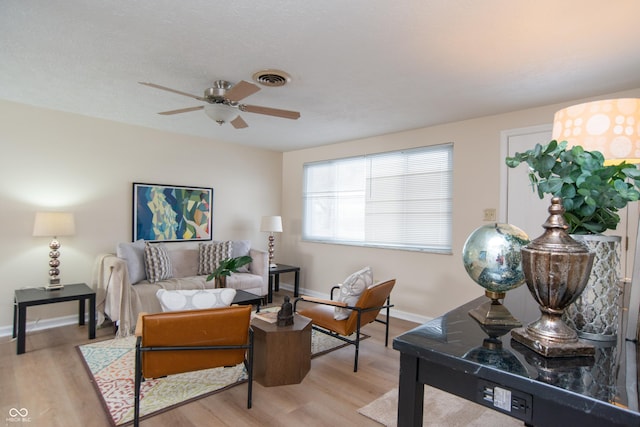 sitting room featuring ceiling fan and light hardwood / wood-style flooring