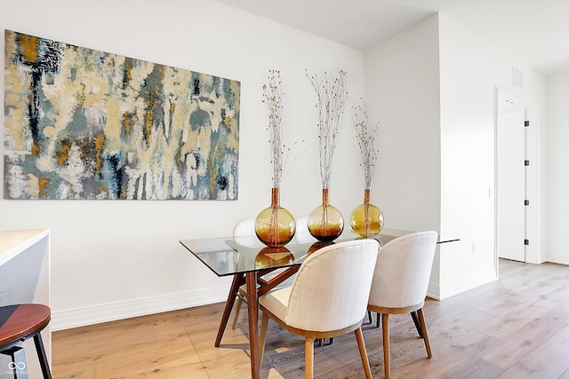 dining space featuring hardwood / wood-style flooring