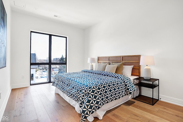 bedroom with light wood-type flooring