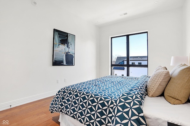 bedroom featuring wood-type flooring