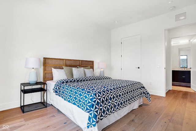 bedroom with wood-type flooring