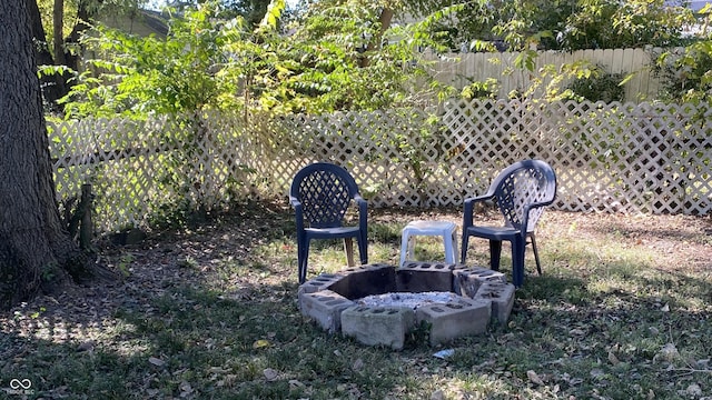 view of yard with a fire pit