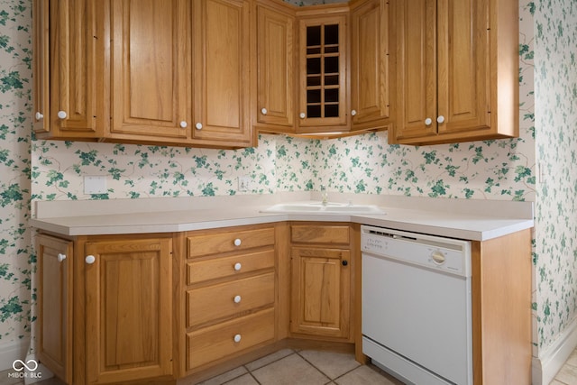1023 Franklin St, Columbus, IN 47201 - kitchen with light tile patterned floors, white dishwasher, and sink
