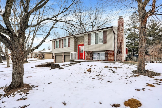 raised ranch featuring a garage