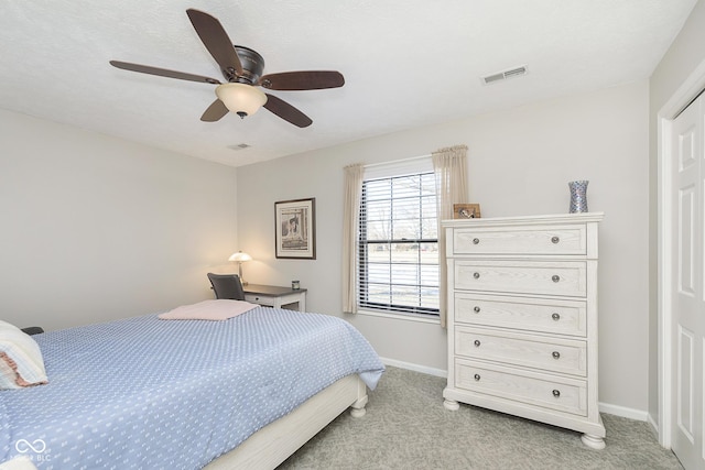 bedroom featuring ceiling fan and light colored carpet