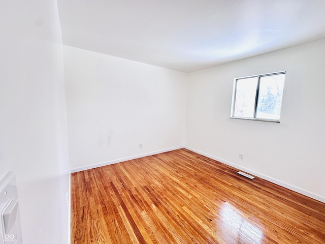 spare room with light hardwood / wood-style floors