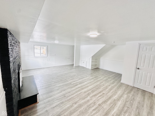 bonus room with light hardwood / wood-style floors