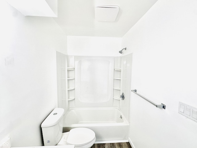 bathroom featuring toilet, bathtub / shower combination, and wood-type flooring