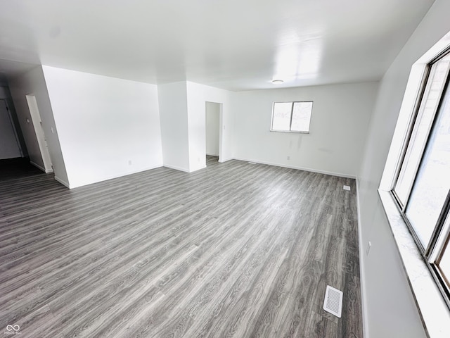 unfurnished room with wood-type flooring