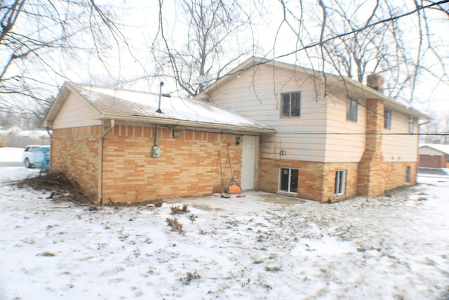 view of snow covered house