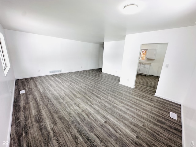 interior space with dark hardwood / wood-style floors