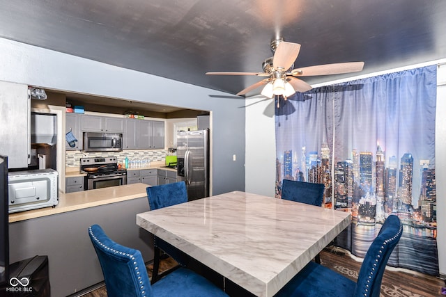 dining space featuring ceiling fan