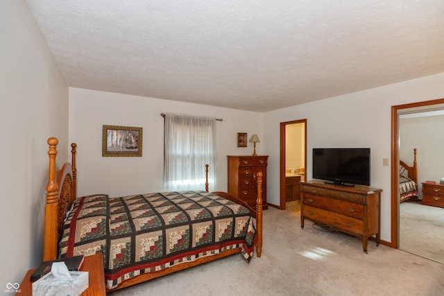 carpeted bedroom with a textured ceiling