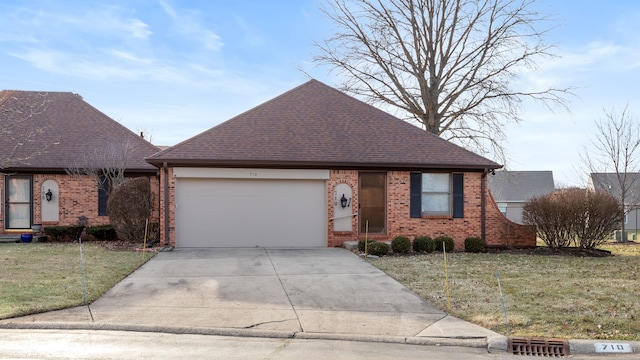 view of front facade with a garage and a front yard