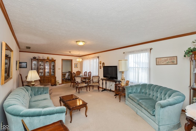 living room with ornamental molding, carpet floors, and a textured ceiling