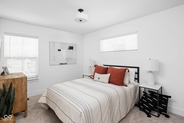 bedroom featuring light carpet