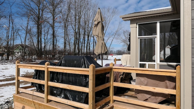 view of snow covered deck