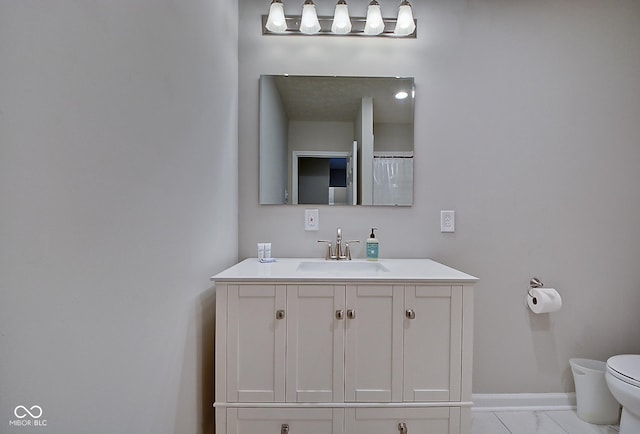 bathroom with vanity and toilet