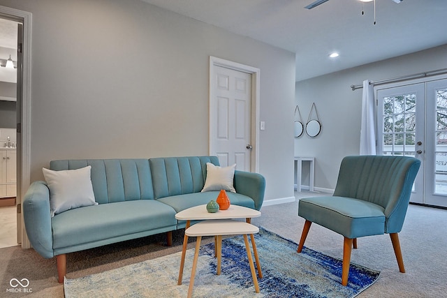 living room with carpet floors, ceiling fan, and french doors