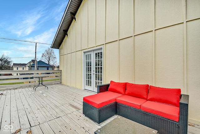 wooden deck with outdoor lounge area and french doors